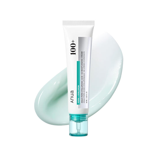 Tube of skincare cream with a light green color swatch on a white background